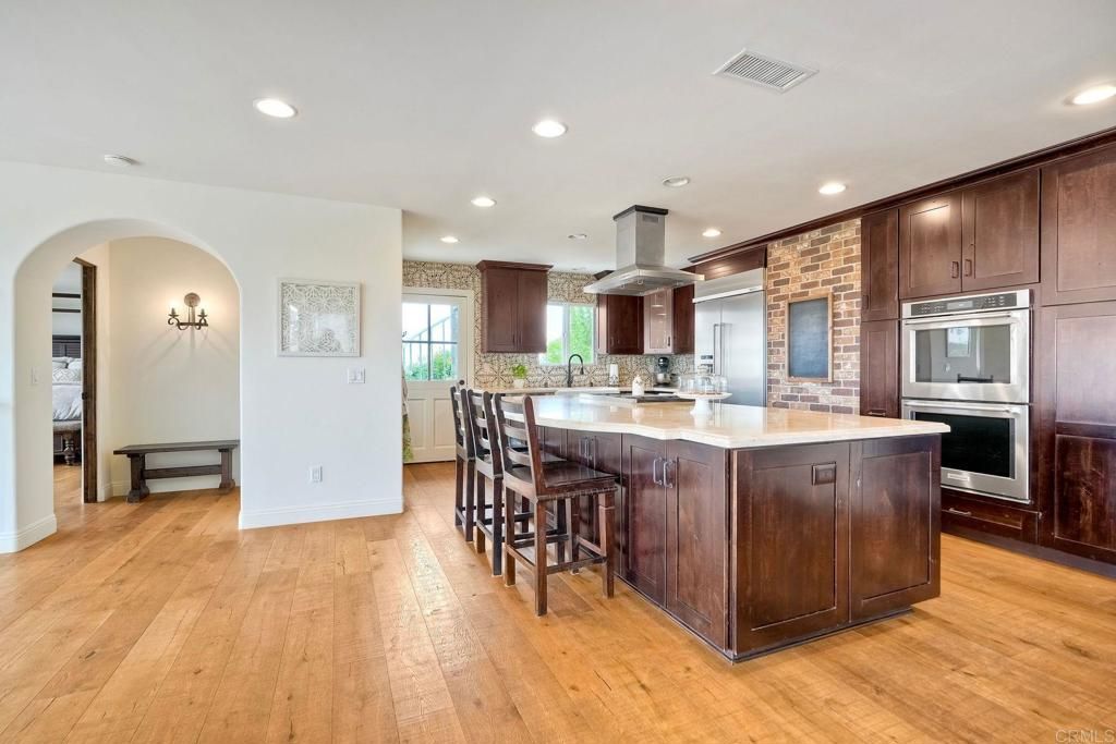 Interior, Kitchen, Recessed Lighting, Stainless Steel Appliances, Stone Walls, Wood Texture Flooring