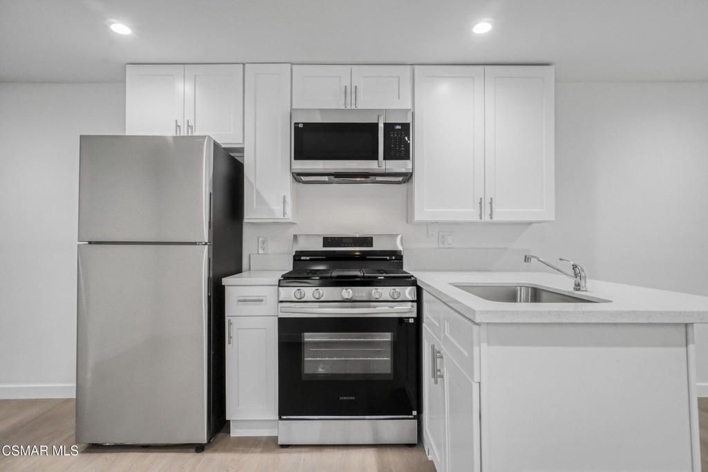 Interior, Kitchen, Recessed Lighting, Stainless Steel Appliances, Wood Texture Flooring
