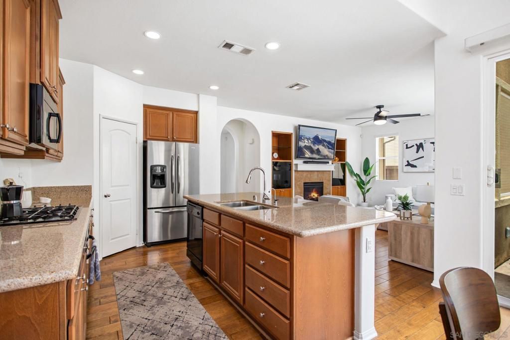 Fireplace, Interior, Kitchen, Living room, Recessed Lighting, Stainless Steel Appliances, Wood Texture Flooring