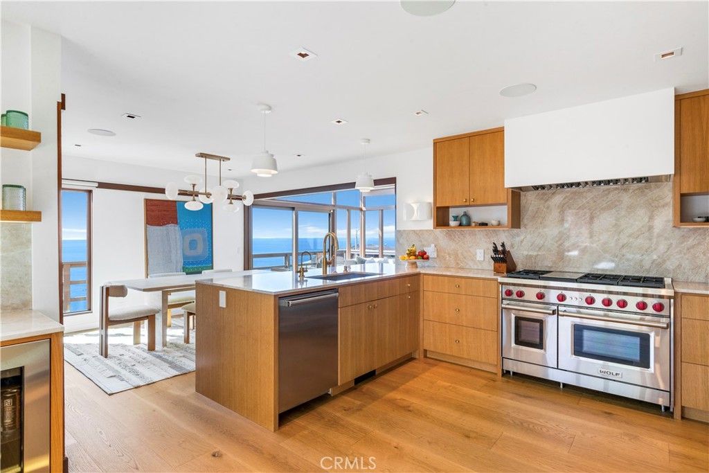 Dining room, Interior, Kitchen, Pendant Lights, Recessed Lighting, Stainless Steel Appliances, Water, Wood Texture Flooring