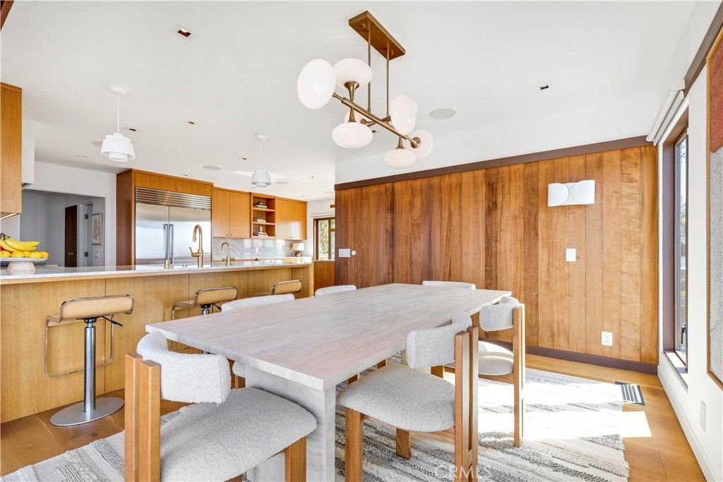 Dining room, Interior, Kitchen, Pendant Lights, Recessed Lighting, Stainless Steel Appliances, Wood Texture Flooring, Wooden Walls