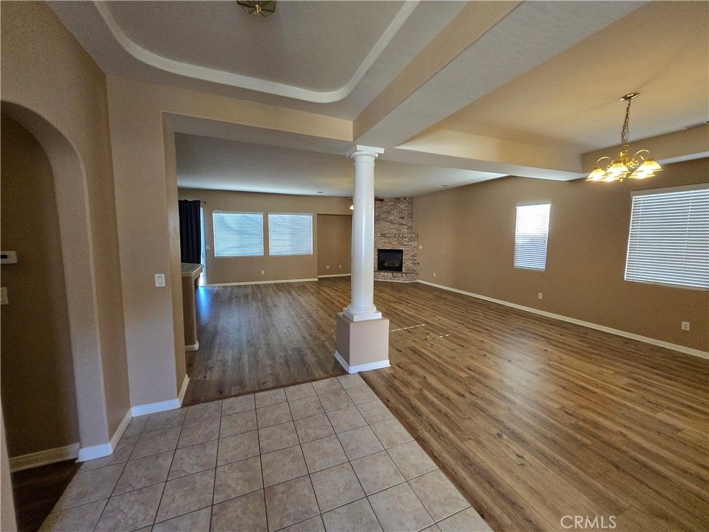 Empty room, Fireplace, Interior, Pendant Lights, Stone Walls, Wood Texture Flooring