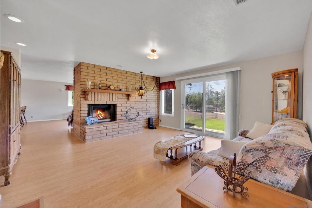 Fireplace, Interior, Living room, Recessed Lighting, Stone Walls, Wood Texture Flooring