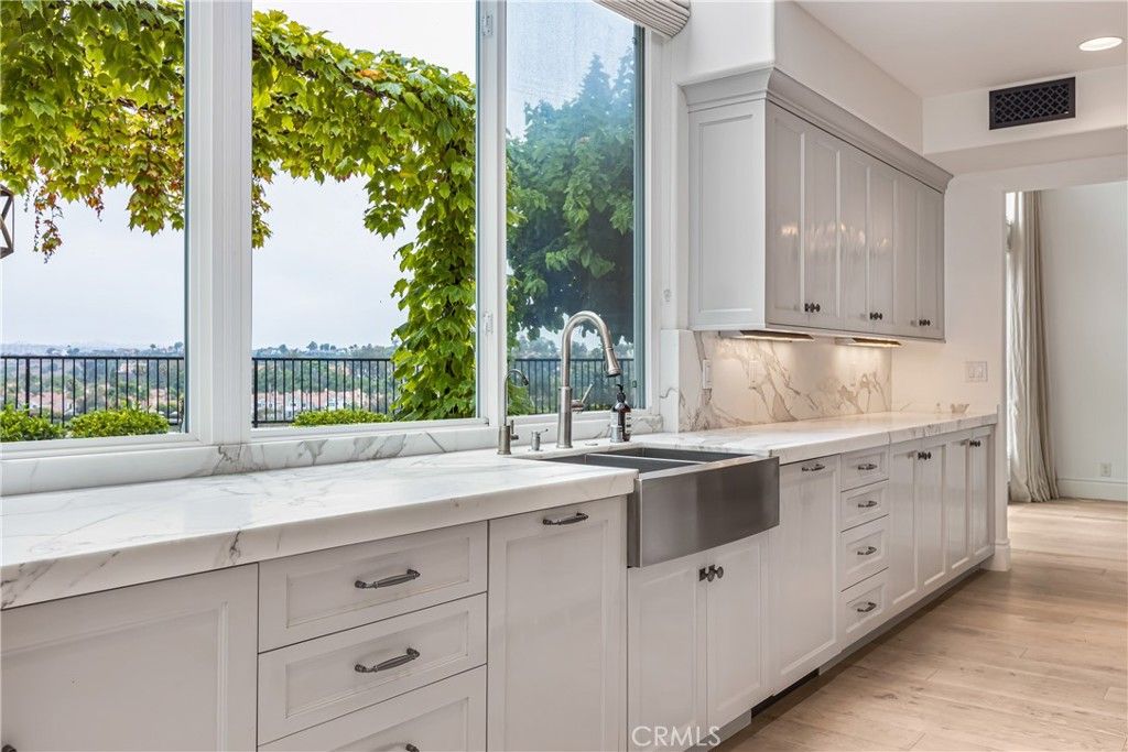 Interior, Kitchen, Marble Walls, Recessed Lighting, Stainless Steel Appliances, Wood Texture Flooring