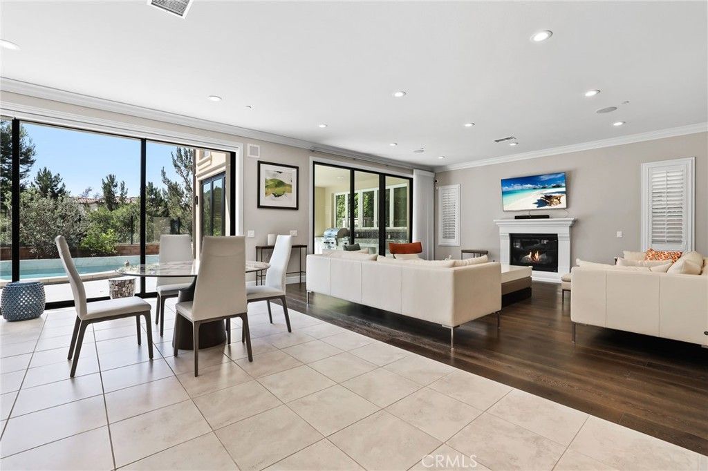 Dining room, Fireplace, Interior, Living room, Recessed Lighting, Wood Texture Flooring