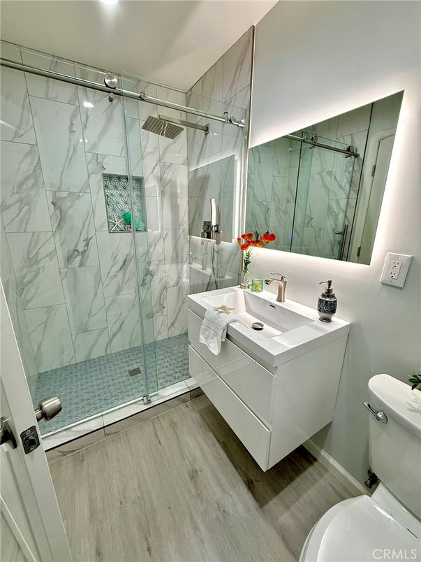 Bathroom, Glass Shower, Interior, Marble Walls, Wood Texture Flooring