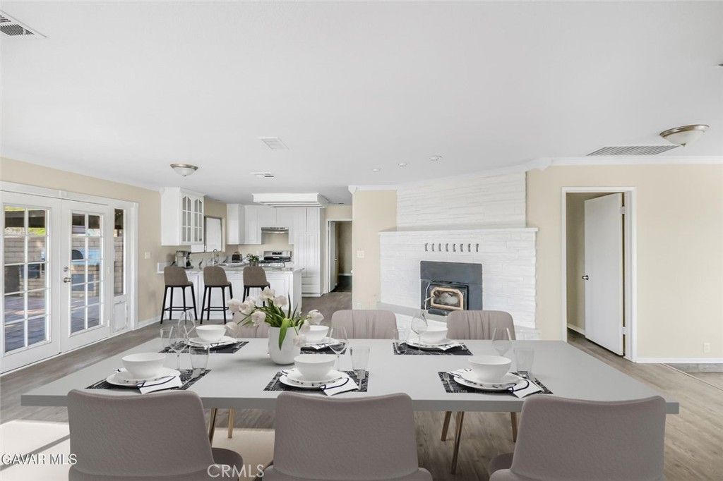 Dining room, Fireplace, Interior, Kitchen, Living room, Recessed Lighting, Stainless Steel Appliances, Wood Texture Flooring