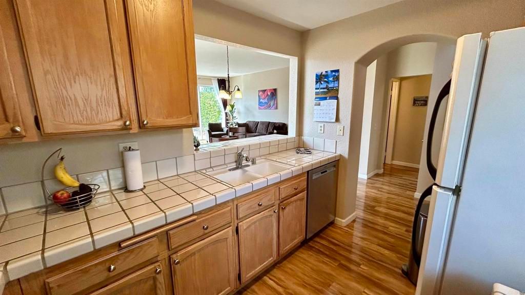 Interior, Kitchen, Pendant Lights, Tile Countertops, Wood Texture Flooring