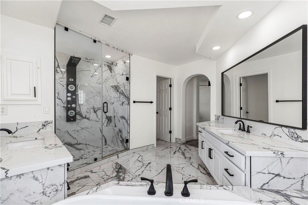 Bathroom, Dual Sink Vanities, Glass Shower, Interior, Marble, Marble Walls, Recessed Lighting