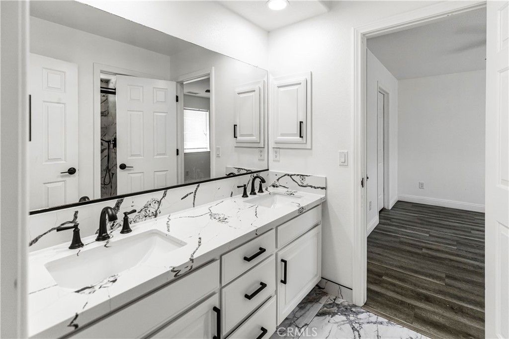 Bathroom, Dual Sink Vanities, Interior, Marble, Recessed Lighting, Wood Texture Flooring