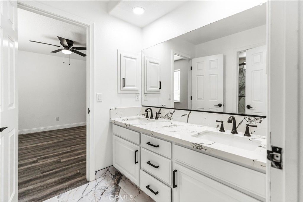 Bathroom, Dual Sink Vanities, Interior, Marble, Recessed Lighting, Wood Texture Flooring