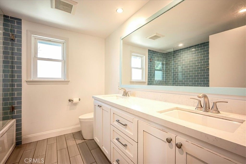 Bathroom, Dual Sink Vanities, Interior, Recessed Lighting, Wood Texture Flooring