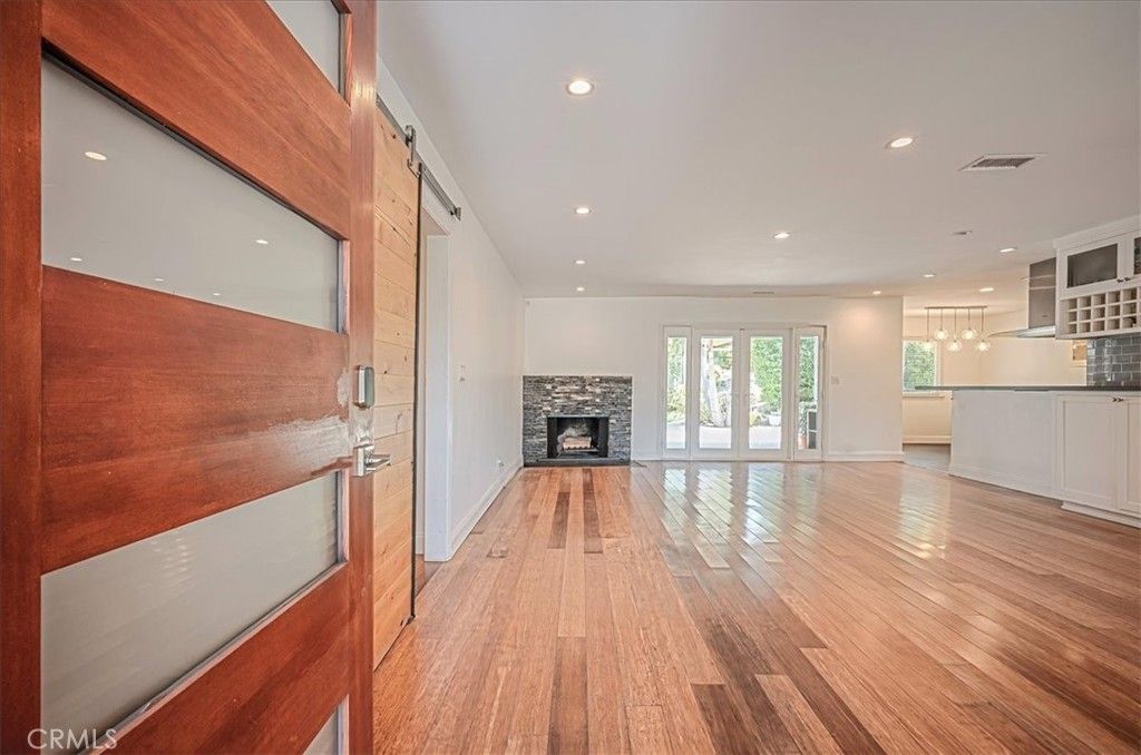 Empty room, Fireplace, Interior, Kitchen, Recessed Lighting, Wood Texture Flooring
