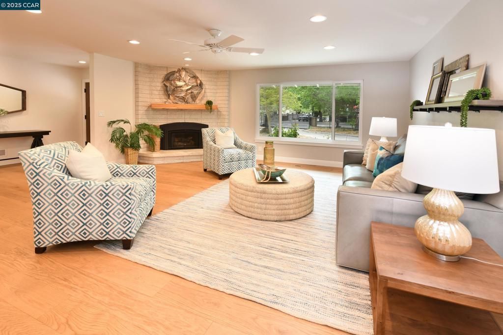 Fireplace, Interior, Living room, Recessed Lighting, Stone Walls, Wood Texture Flooring