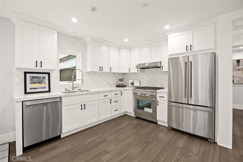 Interior, Kitchen, Marble Walls, Recessed Lighting, Stainless Steel Appliances, Wood Texture Flooring
