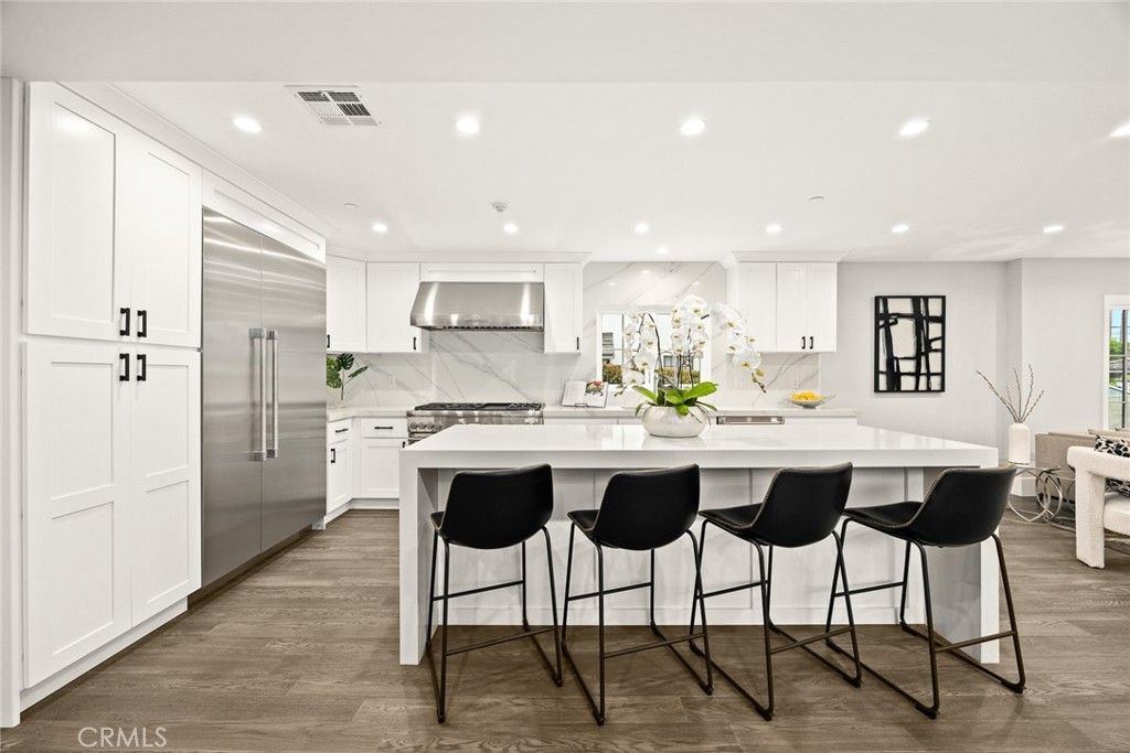 Interior, Kitchen, Marble Walls, Recessed Lighting, Stainless Steel Appliances, Wood Texture Flooring