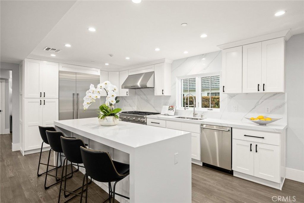 Interior, Kitchen, Marble Walls, Recessed Lighting, Stainless Steel Appliances, Wood Texture Flooring