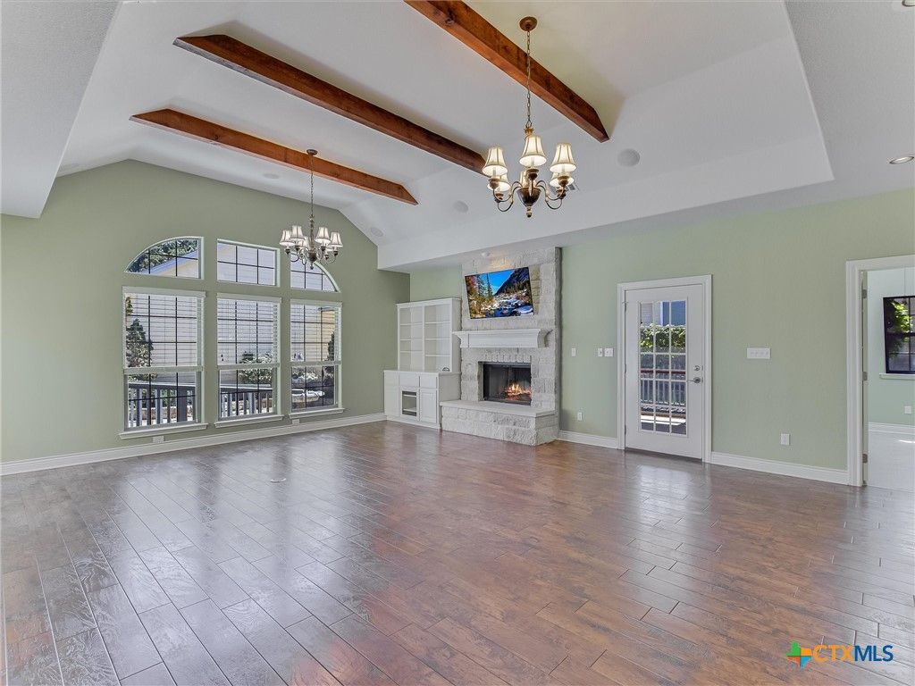 Chandelier, Empty room, Fireplace, Interior, Wooden Beams, Wood Texture Flooring