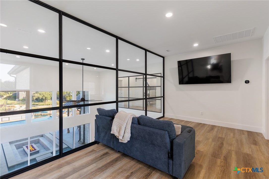 Fireplace, Interior, Living room, Recessed Lighting, Wood Texture Flooring