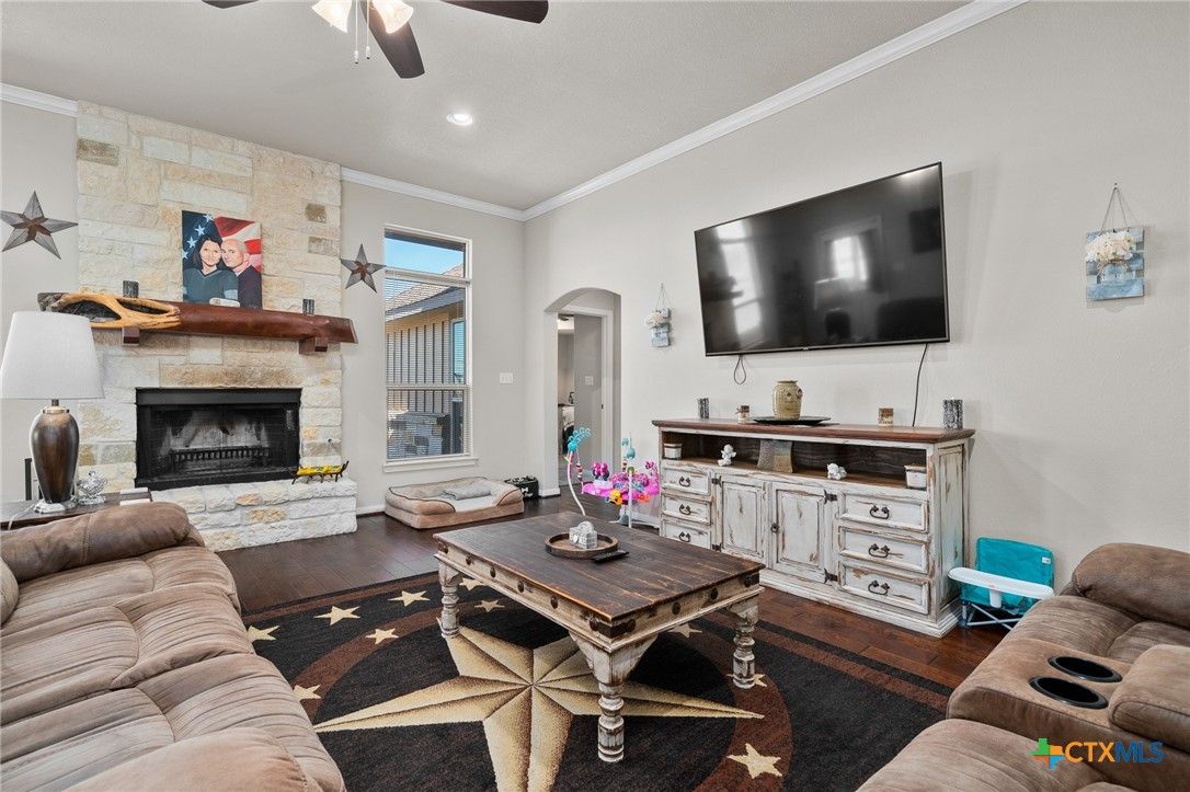 Fireplace, Interior, Living room, Recessed Lighting, Stone Walls, Wood Texture Flooring