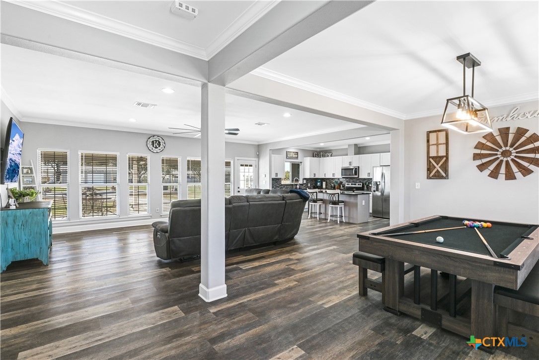 Billiard Table, Game Room, Interior, Kitchen, Living room, Pendant Lights, Recessed Lighting, Stainless Steel Appliances, Wood Texture Flooring