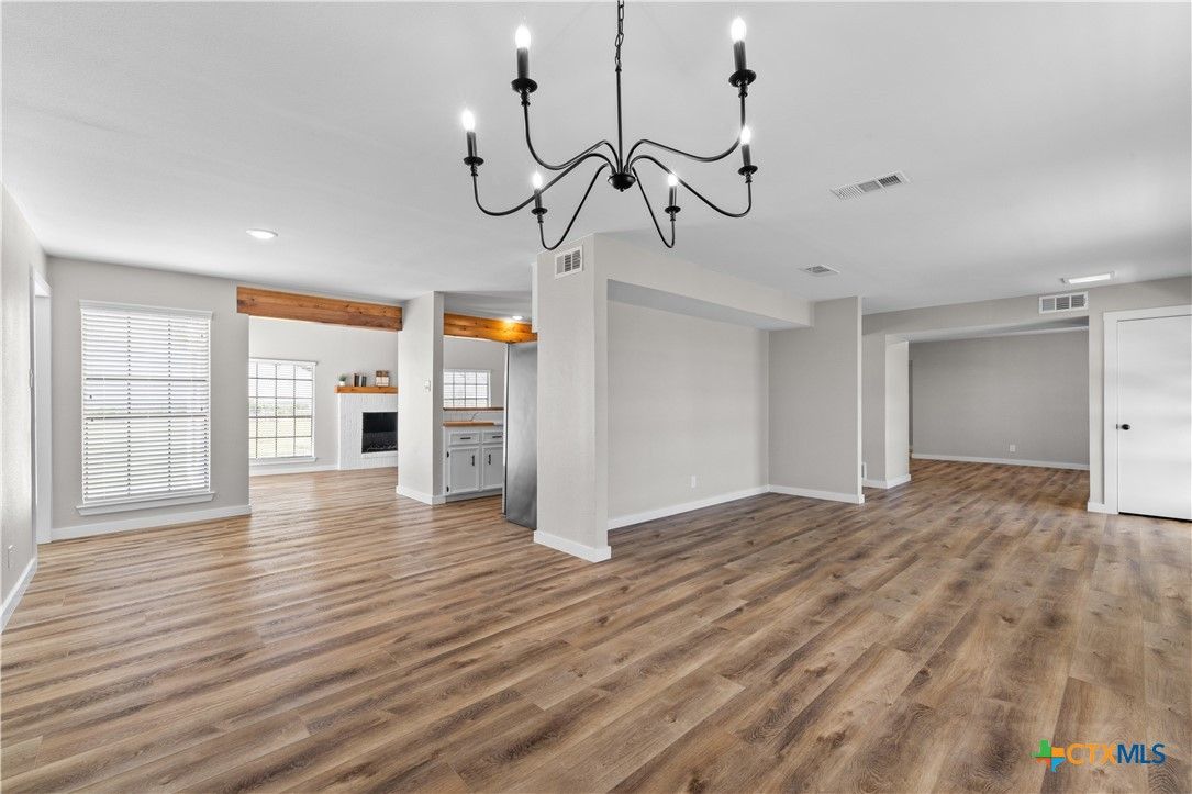 Chandelier, Empty room, Fireplace, Interior, Recessed Lighting, Wood Texture Flooring