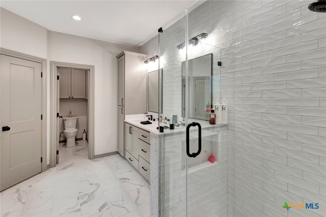 Bathroom, Dual Sink Vanities, Glass Shower, Interior, Marble, Recessed Lighting