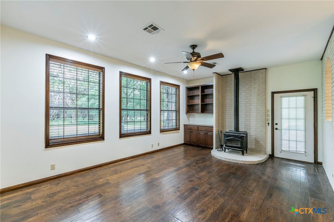 Empty room, Fireplace, Interior, Recessed Lighting, Wood Texture Flooring