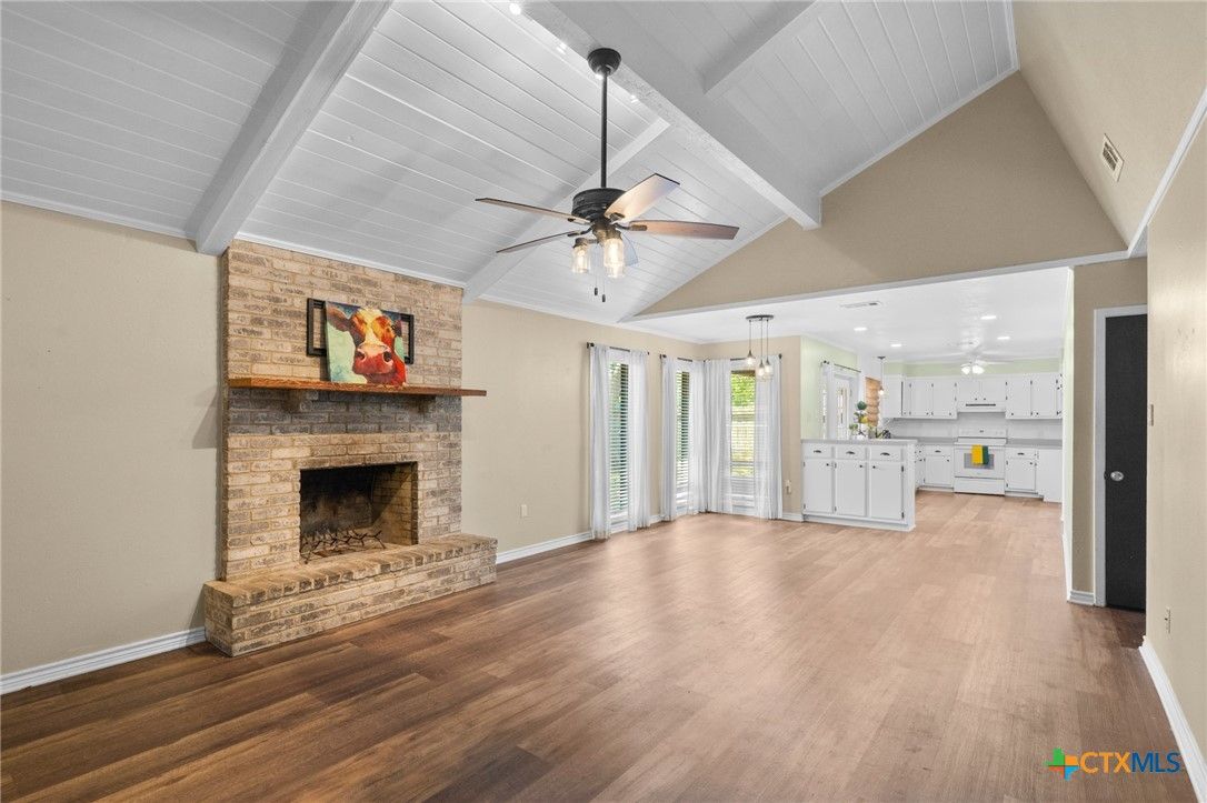 Empty room, Fireplace, Interior, Kitchen, Pendant Lights, Recessed Lighting, Stone Walls, Wood Texture Flooring