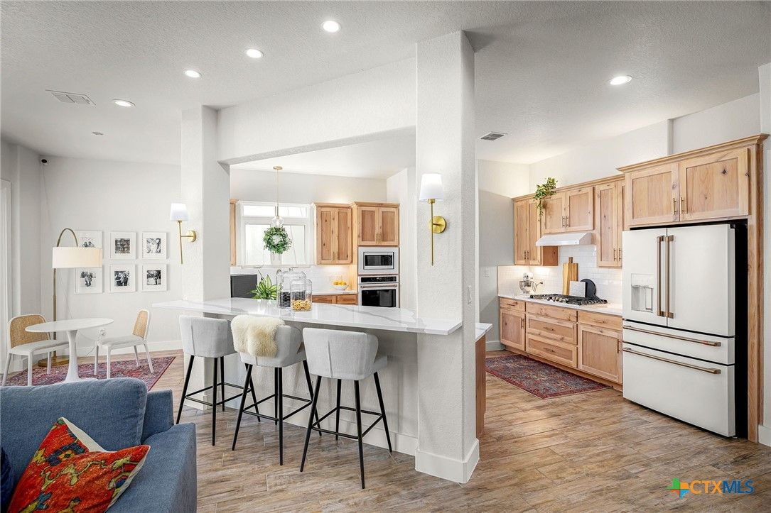 Dining room, Interior, Kitchen, Pendant Lights, Recessed Lighting, Stainless Steel Appliances, Wood Texture Flooring