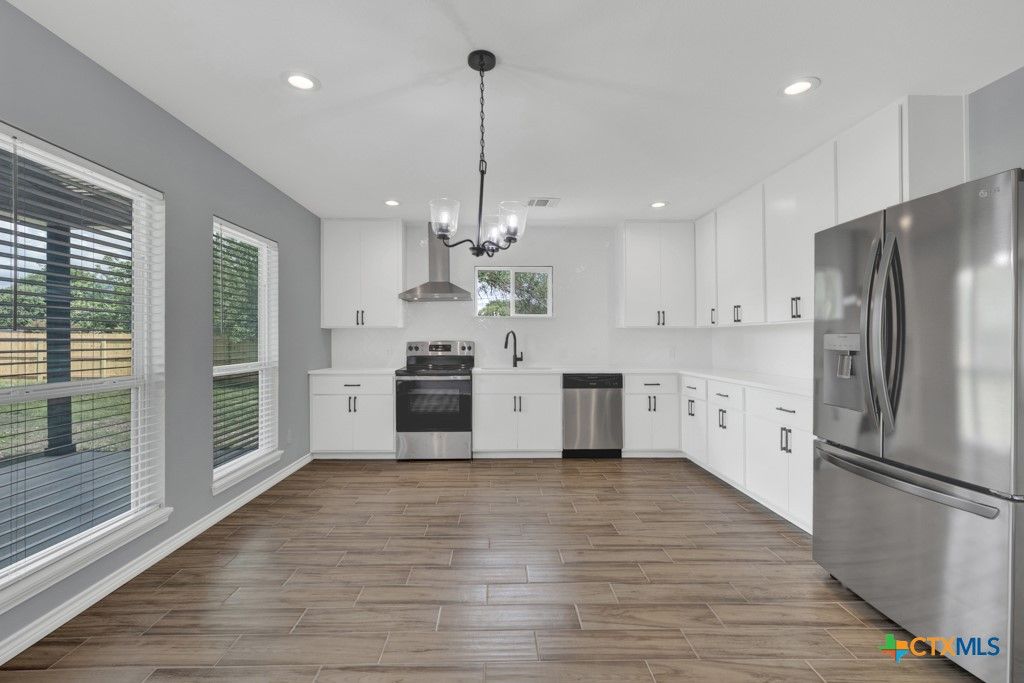 Chandelier, Interior, Kitchen, Pendant Lights, Recessed Lighting, Stainless Steel Appliances, Wood Texture Flooring