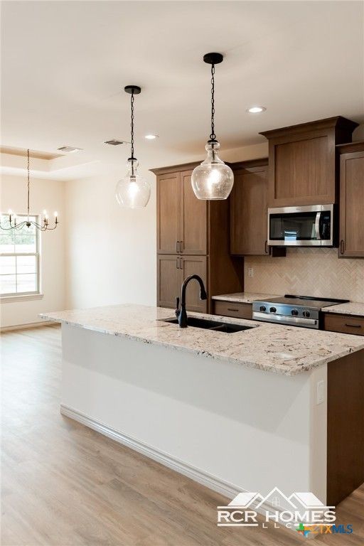 Chandelier, Interior, Kitchen, Pendant Lights, Recessed Lighting, Stainless Steel Appliances, Wood Texture Flooring