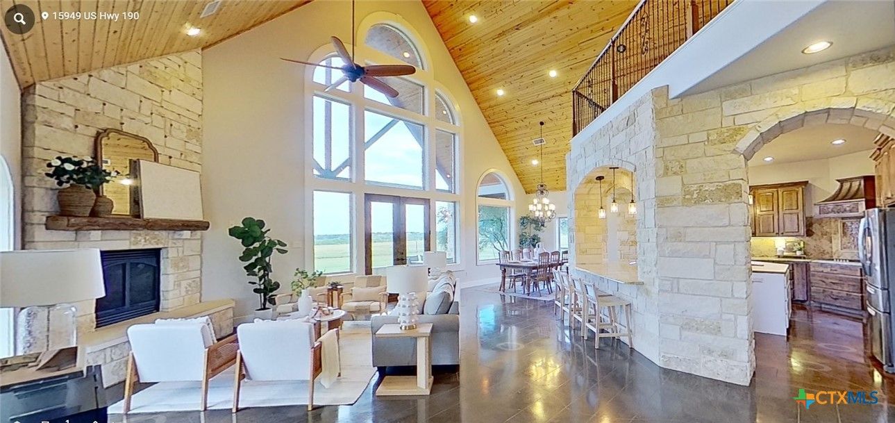 Chandelier, Dining room, Fireplace, Interior, Kitchen, Living room, Pendant Lights, Recessed Lighting, Stone Walls, Water, Wooden Beams, Wooden Ceilings, Wood Texture Flooring