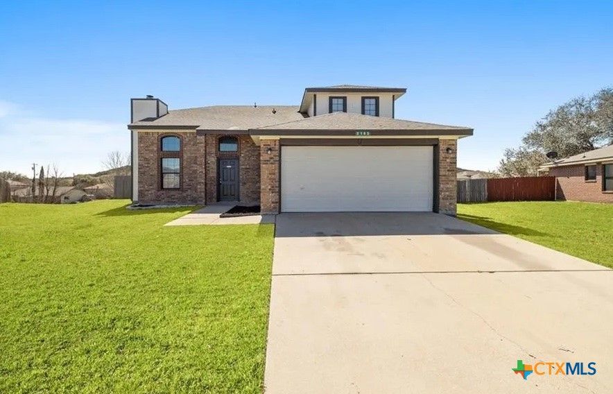Attached, Backyard, Exterior, Facade, Brick Facade, Split Level