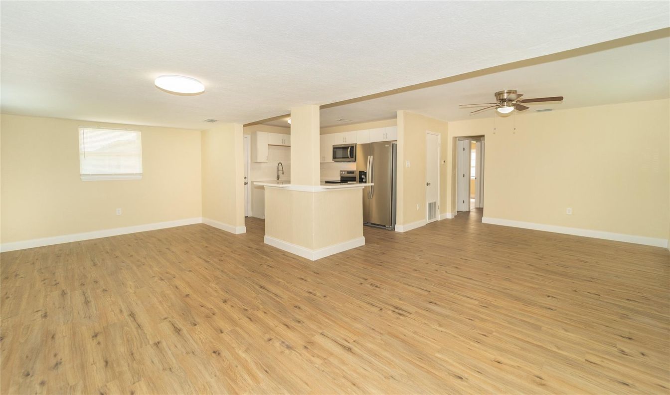 Empty room, Interior, Kitchen, Stainless Steel Appliances, Wood Texture Flooring