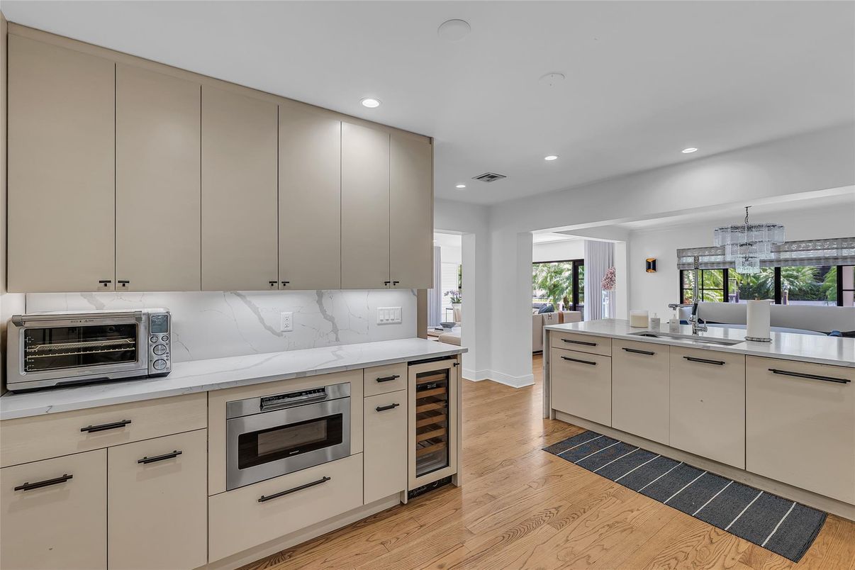 Interior, Kitchen, Marble Walls, Recessed Lighting, Stainless Steel Appliances, Wood Texture Flooring