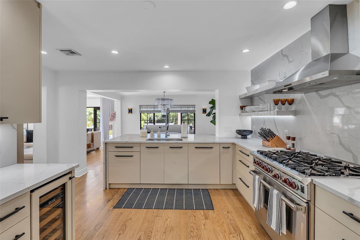 Interior, Kitchen, Marble Walls, Recessed Lighting, Stainless Steel Appliances, Wood Texture Flooring