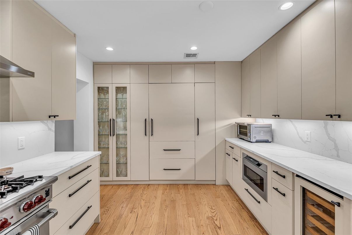 Interior, Kitchen, Marble Walls, Recessed Lighting, Stainless Steel Appliances, Wood Texture Flooring