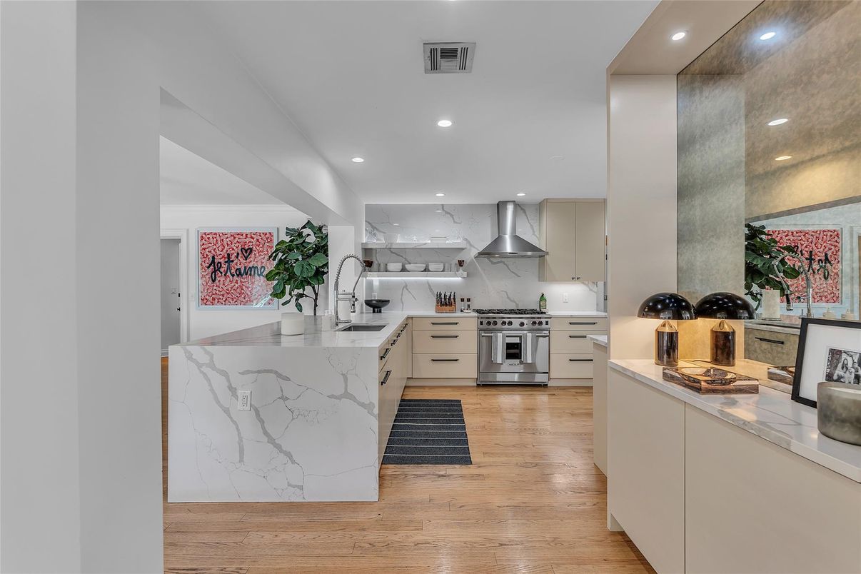 Interior, Kitchen, Marble Walls, Recessed Lighting, Stainless Steel Appliances, Wood Texture Flooring