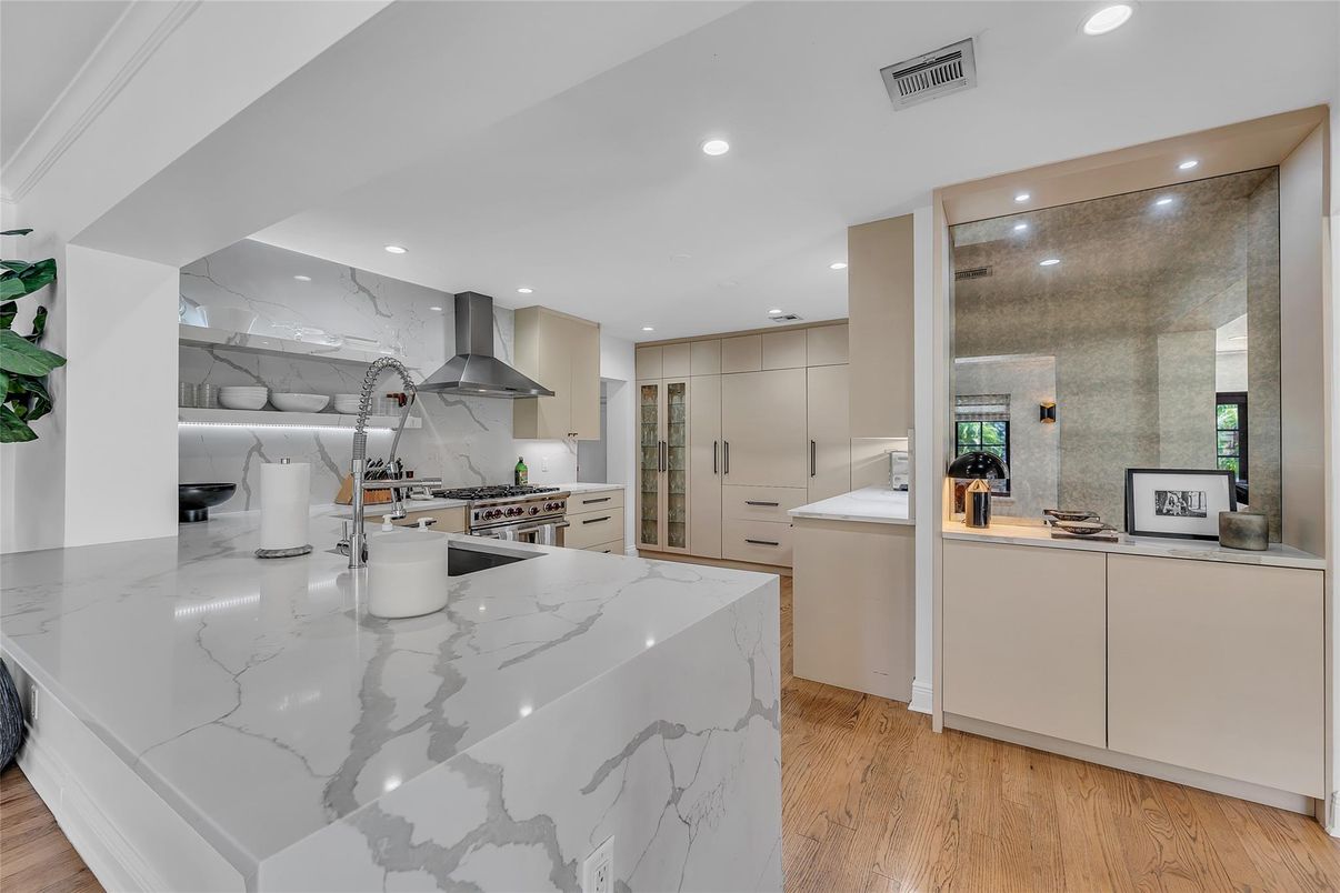 Interior, Kitchen, Marble Walls, Recessed Lighting, Stainless Steel Appliances, Wood Texture Flooring