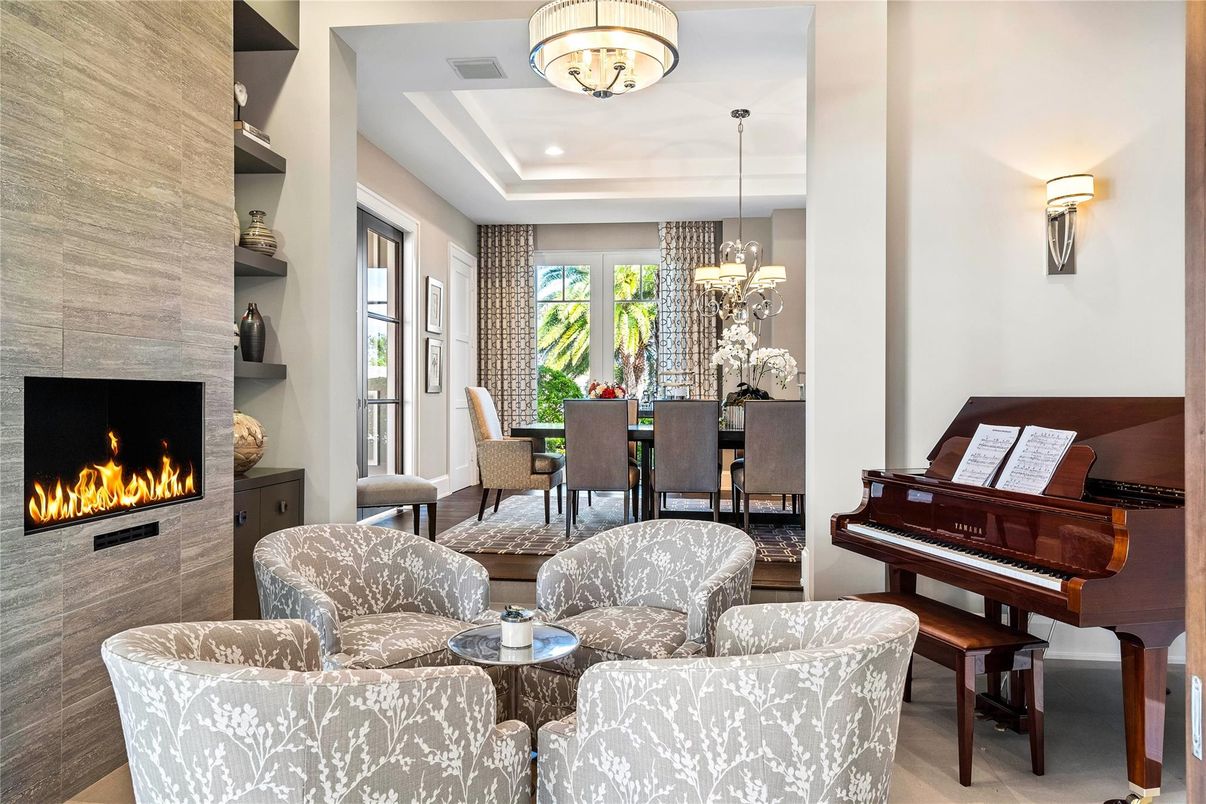 Chandelier, Dining room, Fireplace, Interior, Living room, Pendant Lights, Piano, Recessed Lighting