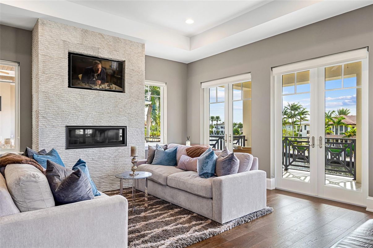 Fireplace, Interior, Living room, Recessed Lighting, Stone Walls, Wood Texture Flooring