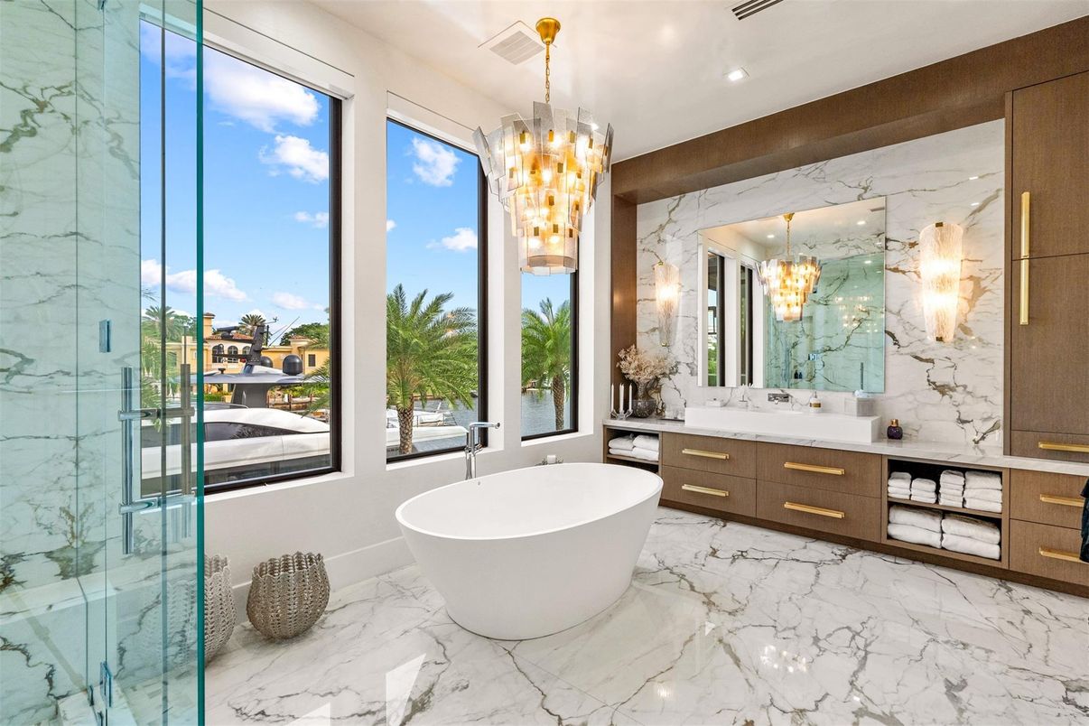 Bathroom, Chandelier, Dual Sink Vanities, Free Standing Baths, Glass Shower, Interior, Marble, Marble Walls, Pendant Lights, Recessed Lighting