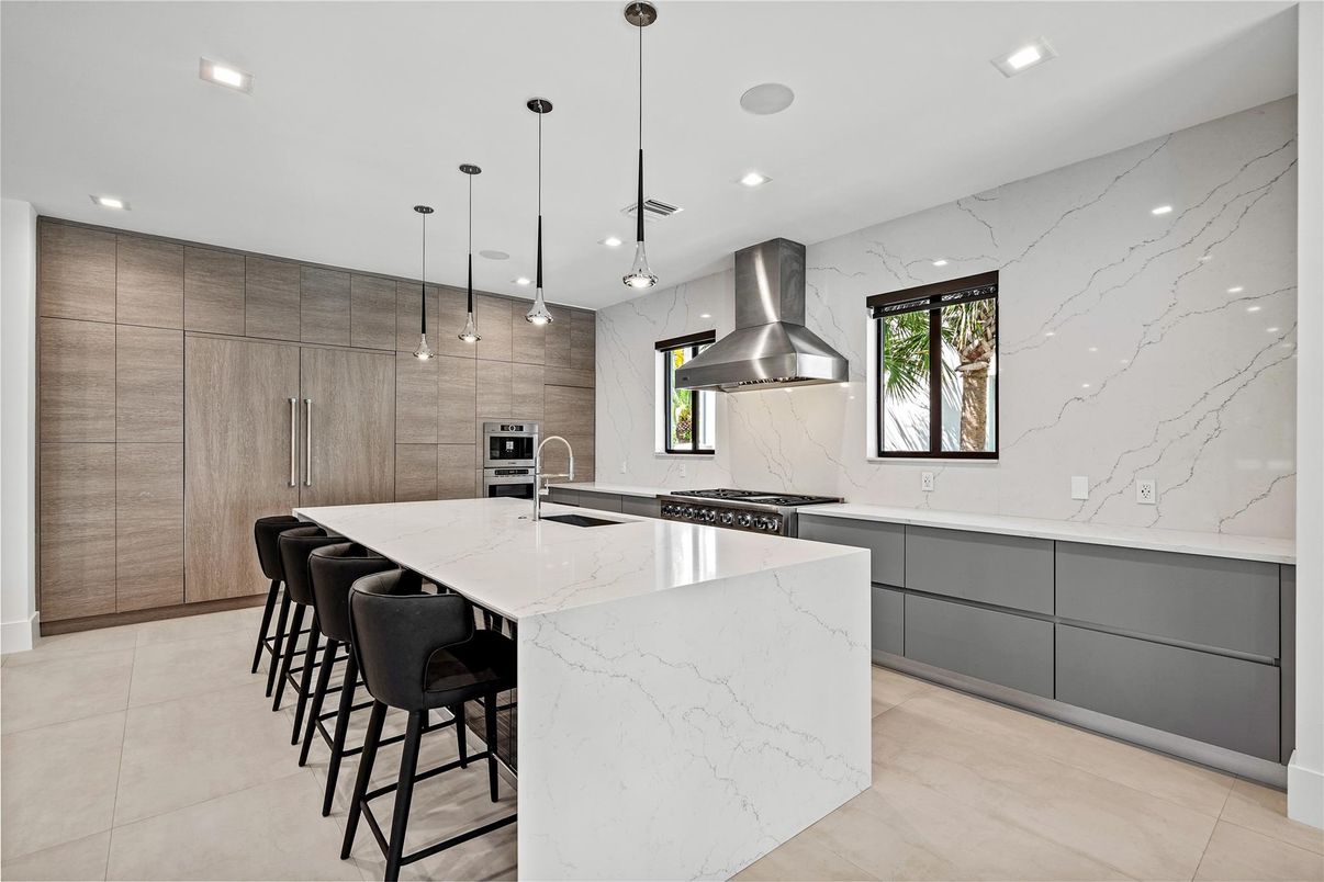 Interior, Kitchen, Marble Walls, Pendant Lights, Recessed Lighting, Stainless Steel Appliances