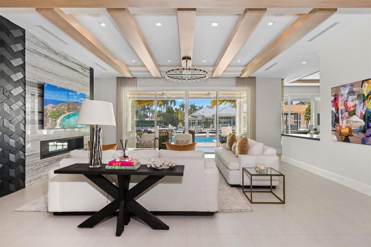 Chandelier, Fireplace, Interior, Living room, Recessed Lighting, Stone Walls, Wooden Beams