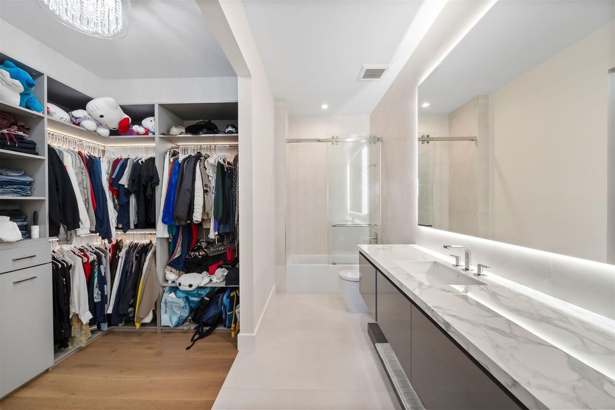 Bathroom, Dual Sink Vanities, Interior, Recessed Lighting, Walk-in Closets, Wood Texture Flooring
