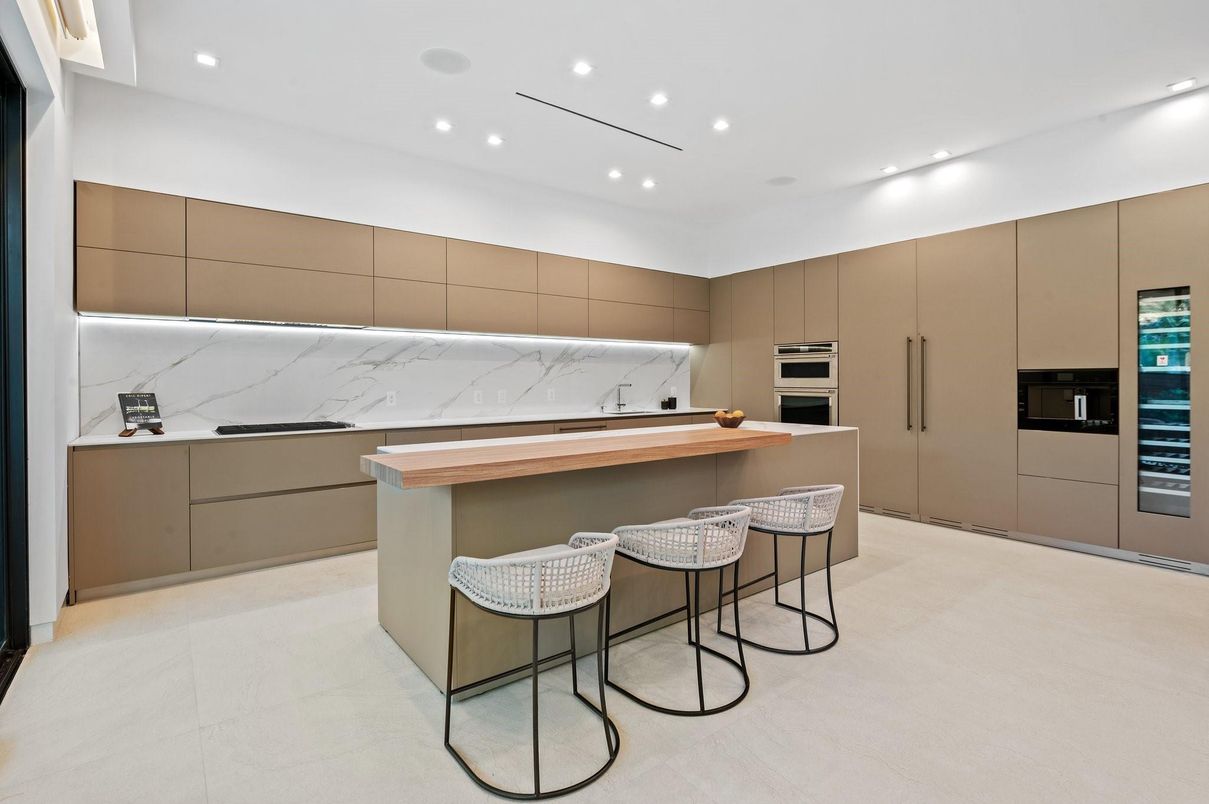 Interior, Kitchen, Marble Walls, Recessed Lighting, Stainless Steel Appliances