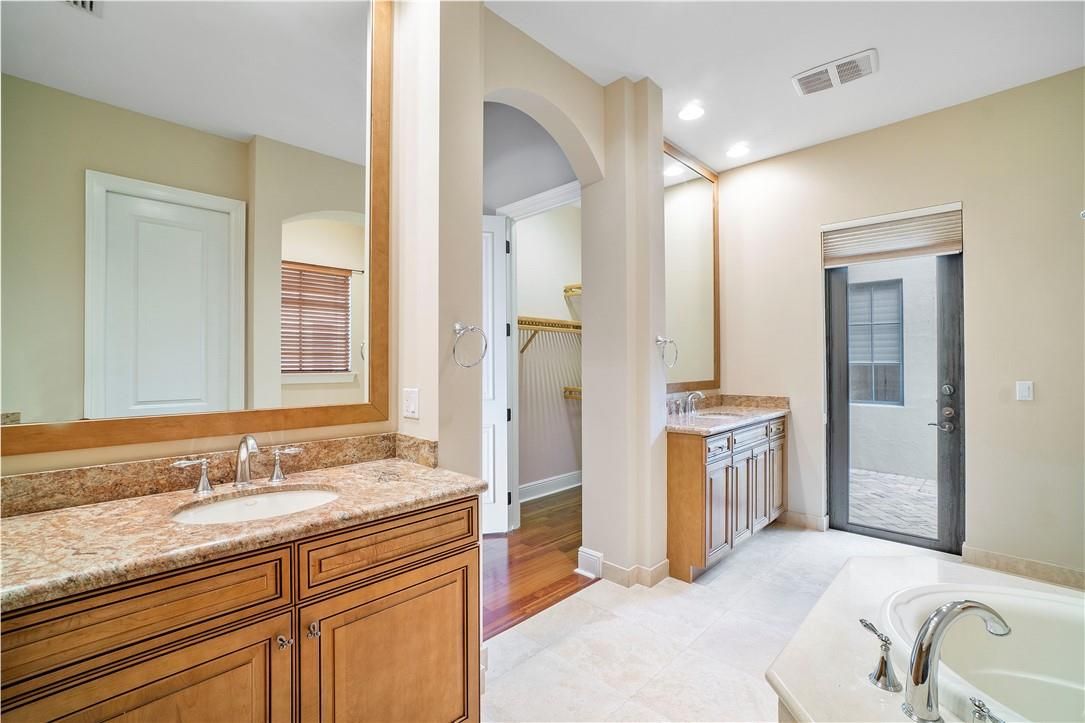 Bathroom, Dual Sink Vanities, Interior, Recessed Lighting, Wood Texture Flooring