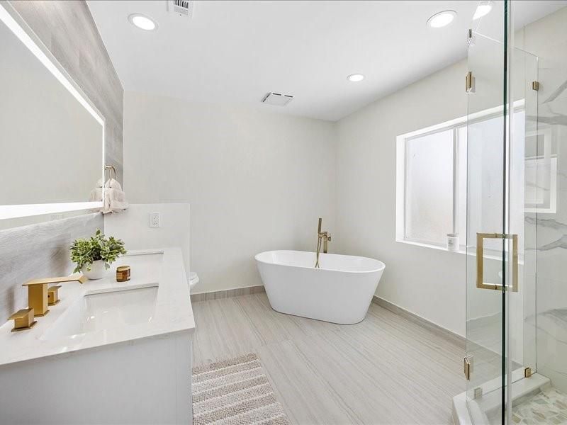 Bathroom, Dual Sink Vanities, Free Standing Baths, Glass Shower, Interior, Recessed Lighting, Wood Texture Flooring