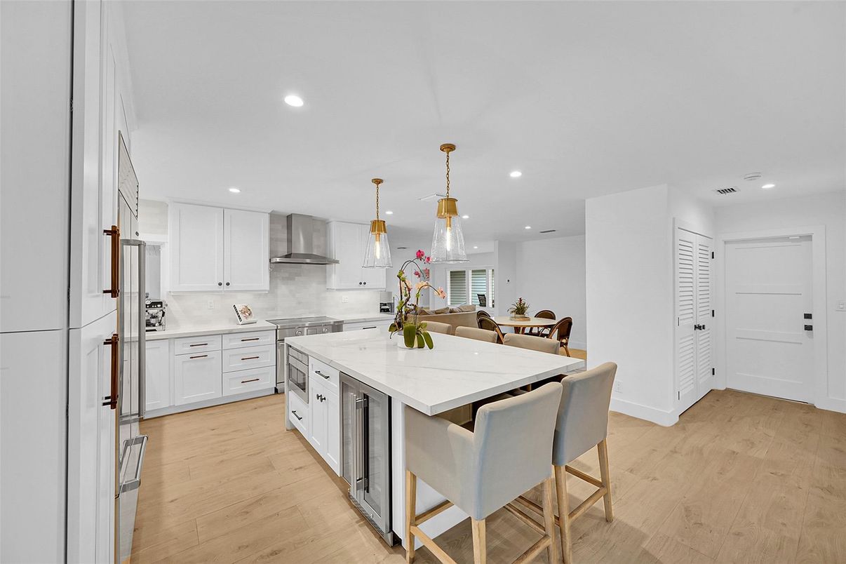 Dining room, Interior, Kitchen, Pendant Lights, Recessed Lighting, Stainless Steel Appliances, Wood Texture Flooring
